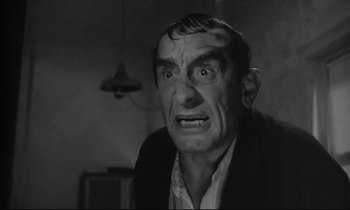 Movie still from “The Fugitive Kind” (1960), directed by Sidney Lumet – An old man with a strange look on his face; Close Up shot, Low angle