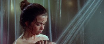 Movie still from “The Funhouse” (1981), directed by Tobe Hooper – A woman is taking a shower in a bathroom; Close Up shot, High angle