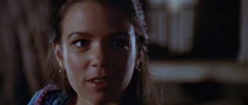 Movie still from “The Funhouse” (1981), directed by Tobe Hooper – A woman's face in a dark room; Close Up shot, Low angle