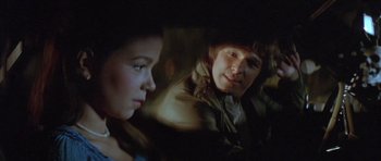 Movie still from “The Funhouse” (1981), directed by Tobe Hooper – A woman sitting next to a man in the dark; Close Up shot, Over the shoulder angle