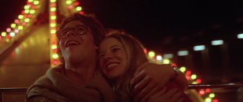 Movie still from “The Funhouse” (1981), directed by Tobe Hooper – A man and a woman are hugging each other; Close Up shot, Low angle