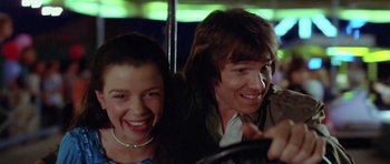 Movie still from “The Funhouse” (1981), directed by Tobe Hooper – Two people sitting next to each other on a bus; Close Up shot, Low angle