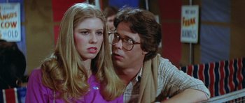 Movie still from “The Funhouse” (1981), directed by Tobe Hooper – A man and a woman sitting next to each other; Close Up shot, Over the shoulder angle