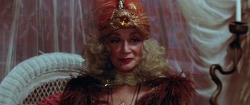 Movie still from “The Funhouse” (1981), directed by Tobe Hooper – A person wearing a hat; Close Up shot, Low angle