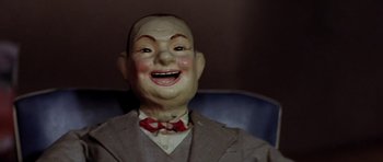 Movie still from “The Funhouse” (1981), directed by Tobe Hooper – The face of an old doll; Close Up shot, High angle