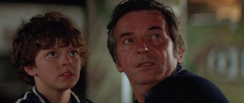 Movie still from “The Funhouse” (1981), directed by Tobe Hooper – A man and a woman looking into the distance; Close Up shot, Low angle