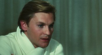 Movie still from “The Garden of the Finzi-Continis” (1970), directed by Vittorio De Sica – A person wearing a white shirt; Close Up shot, High angle