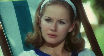 Movie still from “The Garden of the Finzi-Continis” (1970), directed by Vittorio De Sica – A person wearing a headband; Close Up shot, Low angle