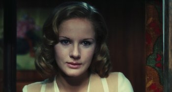 Movie still from “The Garden of the Finzi-Continis” (1970), directed by Vittorio De Sica – A person with short hair; Close Up shot, Over the shoulder angle