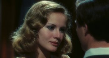 Movie still from “The Garden of the Finzi-Continis” (1970), directed by Vittorio De Sica – A person wearing a dress; Close Up shot, Over the shoulder angle