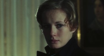 Movie still from “The Garden of the Finzi-Continis” (1970), directed by Vittorio De Sica – A person wearing a jacket; Close Up shot, Over the shoulder angle