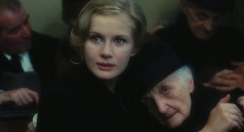 Movie still from “The Garden of the Finzi-Continis” (1970), directed by Vittorio De Sica – A woman and an old woman are looking at the camera; Close Up shot, Over the shoulder angle
