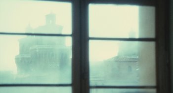 Movie still from “The Garden of the Finzi-Continis” (1970), directed by Vittorio De Sica – A view of a building through a window; Extreme Close Up shot, Low angle