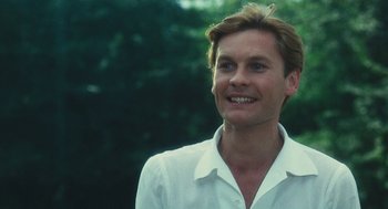 Movie still from “The Garden of the Finzi-Continis” (1970), directed by Vittorio De Sica – A person wearing a white shirt; Close Up shot, Low angle