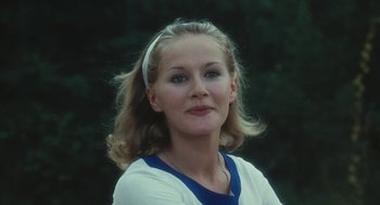 Movie still from “The Garden of the Finzi-Continis” (1970), directed by Vittorio De Sica – A person wearing a white and blue shirt; Close Up shot, Low angle