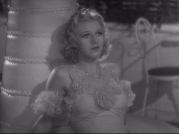 Movie still from “The Gay Divorcee” (1934), directed by Mark Sandrich – A black - and - white photo of a woman in a dress; Medium shot, High angle