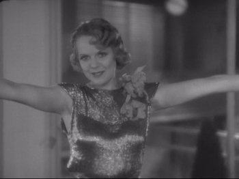 Movie still from “The Gay Divorcee” (1934), directed by Mark Sandrich – An old photo of a woman holding a teddy bear; Medium shot, Low angle
