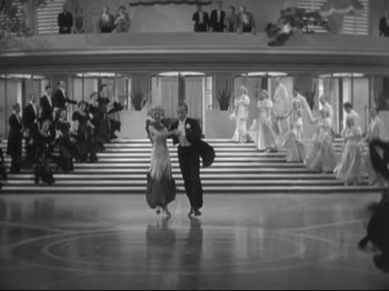 Movie still from “The Gay Divorcee” (1934), directed by Mark Sandrich – A couple of people that are dancing in a room; Wide shot, High angle