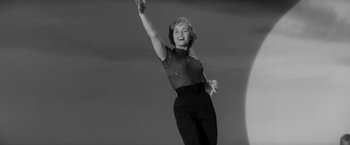 Movie still from “The Gazebo” (1959), directed by George Marshall – An old photo of a woman in a black and white photo; Medium shot, Low angle