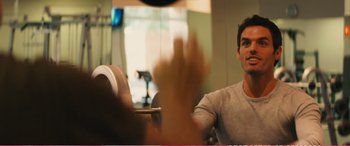 Movie still from “The Girlfriend Experience” (2009), directed by Steven Soderbergh – A man sitting at a table in front of a window; Close Up shot, Over the shoulder angle