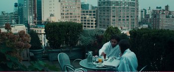 Movie still from “The Girlfriend Experience” (2009), directed by Steven Soderbergh – A man and a woman sitting at an outdoor table; Medium shot, Over the shoulder angle