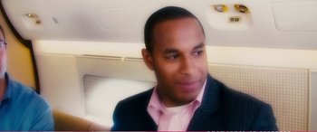 Movie still from “The Girlfriend Experience” (2009), directed by Steven Soderbergh – A person wearing a suit and tie; Close Up shot, Over the shoulder angle