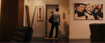 Movie still from “The Girlfriend Experience” (2009), directed by Steven Soderbergh – A man standing in front of an open door of an elevator; Wide shot, Low angle