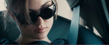 Movie still from “The Girlfriend Experience” (2009), directed by Steven Soderbergh – A person wearing sunglasses in a car; Close Up shot, Over the shoulder angle