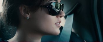 Movie still from “The Girlfriend Experience” (2009), directed by Steven Soderbergh – A person wearing sunglasses in a car; Close Up shot, Over the shoulder angle