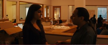 Movie still from “The Girlfriend Experience” (2009), directed by Steven Soderbergh – A man and a woman are talking in a room; Medium shot, Over the shoulder angle