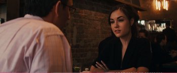 Movie still from “The Girlfriend Experience” (2009), directed by Steven Soderbergh – A woman sitting at a table in front of a man; Close Up shot, Over the shoulder angle