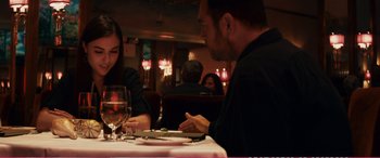 Movie still from “The Girlfriend Experience” (2009), directed by Steven Soderbergh – A man and a woman sitting at a table in a restaurant; Medium shot, Over the shoulder angle