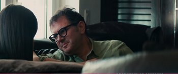 Movie still from “The Girlfriend Experience” (2009), directed by Steven Soderbergh – A person sitting on a couch; Close Up shot, Over the shoulder angle