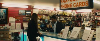 Movie still from “The Girlfriend Experience” (2009), directed by Steven Soderbergh – A man and a woman at a phone booth; Medium shot, High angle