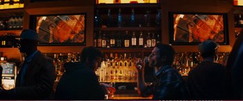 Movie still from “The Girlfriend Experience” (2009), directed by Steven Soderbergh – Two men are sitting at a bar drinking wine; Medium shot, Over the shoulder angle