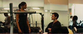 Movie still from “The Girlfriend Experience” (2009), directed by Steven Soderbergh – A man and a woman in a gym talking to each other; Medium shot, Over the shoulder angle