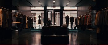 Movie still from “The Girlfriend Experience” (2009), directed by Steven Soderbergh – A woman standing in front of mannequins inside a store; Wide shot, Over the shoulder angle