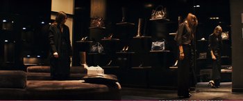 Movie still from “The Girlfriend Experience” (2009), directed by Steven Soderbergh – A room filled with bags and shoes on display; Wide shot, High angle