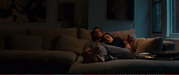 Movie still from “The Girlfriend Experience” (2009), directed by Steven Soderbergh – A man and a woman laying on a couch in a living room; Wide shot, High angle