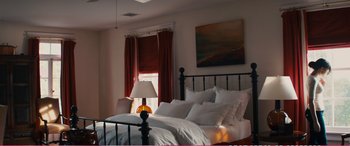 Movie still from “The Girlfriend Experience” (2009), directed by Steven Soderbergh – A bed room with a bed and a lamp in it; Wide shot, High angle