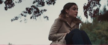 Movie still from “The Girlfriend Experience” (2009), directed by Steven Soderbergh – A young woman wearing a coat with a fur collar; Medium shot, Low angle