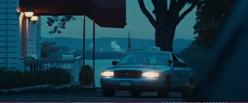 Movie still from “The Girlfriend Experience” (2009), directed by Steven Soderbergh – A taxi cab driving down the street at night; Wide shot, Over the shoulder angle