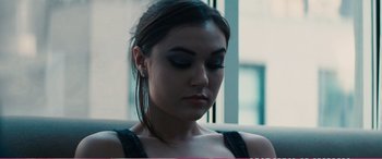 Movie still from “The Girlfriend Experience” (2009), directed by Steven Soderbergh – A person wearing a black shirt; Close Up shot, Over the shoulder angle