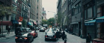 Movie still from “The Girlfriend Experience” (2009), directed by Steven Soderbergh – A busy city street filled with cars and people; Extreme Wide shot, High angle