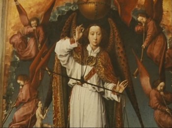 Movie still from “The Gleaners & I” (2000), directed by Agnès Varda – An image of a painting of an angel holding a spear; Medium shot, Overhead angle