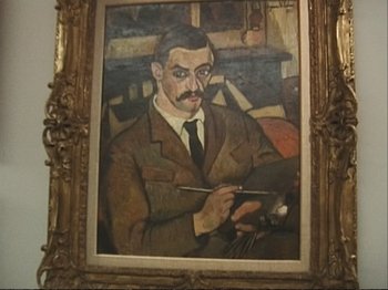 Movie still from “The Gleaners & I” (2000), directed by Agnès Varda – A painting of an older man holding a paintbrush; Close Up shot, Low angle