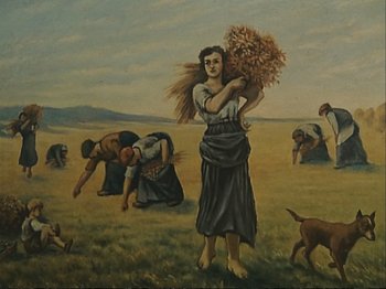 Movie still from “The Gleaners & I” (2000), directed by Agnès Varda – An oil painting of a woman holding a bunch of hay; Wide shot, Low angle