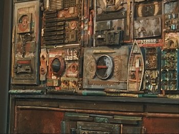 Movie still from “The Gleaners & I” (2000), directed by Agnès Varda – An artistic painting of an old radio set on a wall; Extreme Close Up shot, Overhead angle