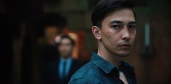 Movie still from “Altered Carbon” (2018), created by Laeta Kalogridis – A person wearing a blue shirt; Close Up shot, Over the shoulder angle