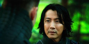 Movie still from “Altered Carbon” (2018), created by Laeta Kalogridis – A person with long black hair; Close Up shot, Over the shoulder angle